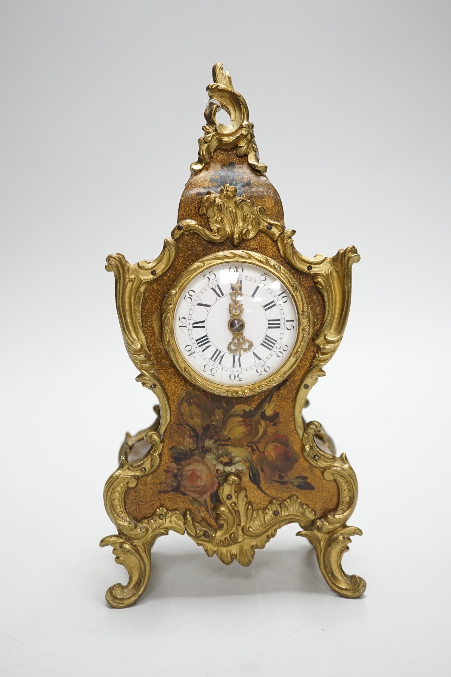 An early 20th century French gilt metal mounted painted mantel timepiece, 25cm
